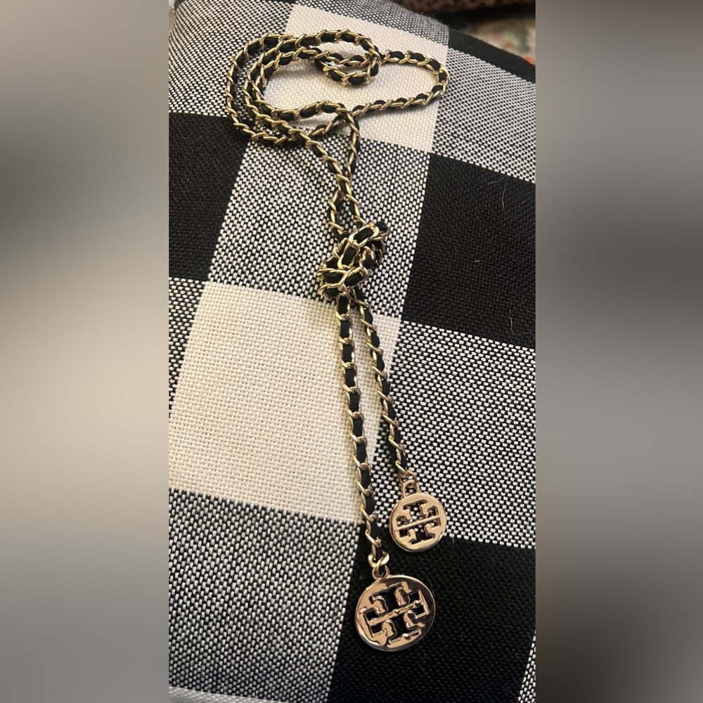 Tory Butch lariat black leather and gold tone necklace.